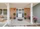 Charming brick home features a welcoming front door with black shutters at 9926 W Nova Pl, Littleton, CO 80127