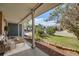 Cozy front porch with seating area offers relaxing outdoor space and scenic views at 9926 W Nova Pl, Littleton, CO 80127