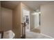 Hallway leading into a bedroom with neutral walls and carpeted floors creating a cozy, inviting atmosphere at 9926 W Nova Pl, Littleton, CO 80127