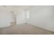Spacious carpeted bedroom with neutral walls and large window at 9892 Cathay St, Commerce City, CO 80022