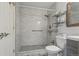 Bathroom featuring tiled shower, sleek fixtures and built-in shelves at 5550 W 80Th Pl # 1, Arvada, CO 80003