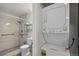 Updated bathroom with a shower, toilet, modern stackable washer and dryer unit at 5550 W 80Th Pl # 1, Arvada, CO 80003