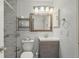 Updated bathroom features a modern vanity and tiled shower at 5550 W 80Th Pl # 1, Arvada, CO 80003