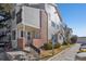 Attractive townhome featuring gray siding, brick accents, and convenient accessible parking in a well-maintained complex at 5550 W 80Th Pl # 1, Arvada, CO 80003