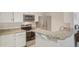 Modern kitchen featuring stainless steel appliances, granite countertops, and a breakfast bar at 5550 W 80Th Pl # 1, Arvada, CO 80003