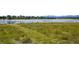 Scenic lake view and grassy area, perfect for relaxation at 5550 W 80Th Pl # 1, Arvada, CO 80003