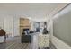 Cozy living room with a stone fireplace, new floors, and ample natural light at 5550 W 80Th Pl # 1, Arvada, CO 80003