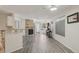 Inviting living space with stone fireplace and wood-look floors offering a comfortable flow at 5550 W 80Th Pl # 1, Arvada, CO 80003