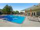 Inviting community pool with lounge chairs and shaded patio area at 5550 W 80Th Pl # 1, Arvada, CO 80003