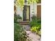 View of front entrance featuring a brick path and front door with wrought iron at 334 Ivy St, Denver, CO 80220