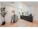 Stylish bar area featuring sleek cabinetry, modern decor, and a cozy table with bar stools at 1928 W 41St Ave, Denver, CO 80211