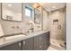 Sleek bathroom with modern fixtures, double sinks, and a glass-enclosed shower for a spa-like experience at 1928 W 41St Ave, Denver, CO 80211