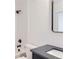 Elegant bathroom featuring modern fixtures, sleek vanity, and shower with black hardware at 1928 W 41St Ave, Denver, CO 80211