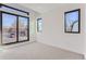 Bright bedroom with large windows offering natural light and neighborhood views at 1928 W 41St Ave, Denver, CO 80211