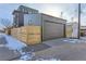 Two-car garage with a modern overhead door and fresh exterior siding, offering convenience at 1928 W 41St Ave, Denver, CO 80211