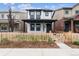 A modern two-story home with black trim and a charming picket fence for curb appeal at 125 Mesa Way, Superior, CO 80027