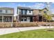 Charming two-story home featuring a black and white design and a classic picket fence at 125 Mesa Way, Superior, CO 80027