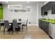 Bright dining room with modern lighting, sleek furniture, and adjacent serving bar at 3453 Navajo St, Denver, CO 80211