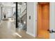 Spacious foyer with a glass staircase, hardwood floors, and an elevator for easy access at 3453 Navajo St, Denver, CO 80211