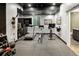 Spacious home gym featuring a treadmill, exercise bike, and weight training equipment at 3453 Navajo St, Denver, CO 80211