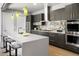 Modern kitchen featuring stainless steel appliances, a center island, and custom cabinetry at 3453 Navajo St, Denver, CO 80211