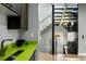 Close up on a modern kitchen with lime countertops, stainless steel appliances, and staircase at 3453 Navajo St, Denver, CO 80211