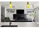 Cozy living room with modern decor, a fireplace, and a seamless flow to the kitchen at 3453 Navajo St, Denver, CO 80211