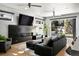 Stylish living room with a fireplace, media center, and access to an outdoor patio at 3453 Navajo St, Denver, CO 80211