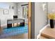 Modern office space with stylish desk, rug and views of outdoors from large windows at 3453 Navajo St, Denver, CO 80211