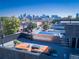 Relax on this rooftop deck with a pool and seating area with views of the city skyline at 3453 Navajo St, Denver, CO 80211