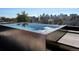Modern rooftop pool with glass edge offers stunning views of the city skyline at 3453 Navajo St, Denver, CO 80211