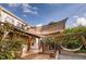 Inviting back deck featuring wooden pergola with shade and a comfortable hammock for relaxation at 10154 Fairgate Way, Highlands Ranch, CO 80126