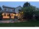 Backyard view showcasing the multi-level deck, patio, hammock and outdoor lighting at 10154 Fairgate Way, Highlands Ranch, CO 80126