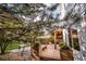 Backyard deck featuring pergola, hammock, and bench seating surrounded by lush greenery at 10154 Fairgate Way, Highlands Ranch, CO 80126