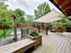 Deck with seating area, hammock, and lush greenery offering relaxation and enjoyment at 10154 Fairgate Way, Highlands Ranch, CO 80126