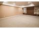 Large finished basement area with neutral carpet and recessed lighting, ready for customization at 10154 Fairgate Way, Highlands Ranch, CO 80126