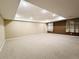 Large, carpeted basement with recessed lighting and neutral paint, offering versatility and potential at 10154 Fairgate Way, Highlands Ranch, CO 80126