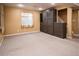 Finished basement with carpet, built in Murphy bed, with extra shelving space at 10154 Fairgate Way, Highlands Ranch, CO 80126