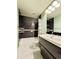 Classic bathroom featuring tile floors, modern vanity, and bathtub with shower at 10154 Fairgate Way, Highlands Ranch, CO 80126