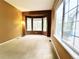 Bright bedroom with bay windows, neutral walls, and plush carpeting at 10154 Fairgate Way, Highlands Ranch, CO 80126
