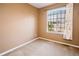 Bedroom featuring carpeted floors, neutral paint and a window with neighborhood views at 10154 Fairgate Way, Highlands Ranch, CO 80126