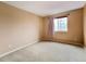 Serene bedroom with ample natural light, carpet flooring, and neutral wall color at 10154 Fairgate Way, Highlands Ranch, CO 80126