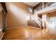 Grand foyer showcases hardwood floors, a staircase, and abundant natural light at 10154 Fairgate Way, Highlands Ranch, CO 80126