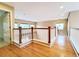Spacious hallway with hardwood floors and white railing with wooden accents at 10154 Fairgate Way, Highlands Ranch, CO 80126