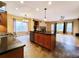 Open-concept kitchen and living room offering modern appliances and hardwood floors at 10154 Fairgate Way, Highlands Ranch, CO 80126