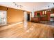 Open kitchen and living area with hardwood floors and stainless steel appliances at 10154 Fairgate Way, Highlands Ranch, CO 80126