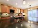 Stylish kitchen showcasing a large center island, granite countertops, and wooden cabinetry at 10154 Fairgate Way, Highlands Ranch, CO 80126
