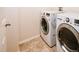 Bright laundry room featuring a side-by-side washer and dryer set at 10154 Fairgate Way, Highlands Ranch, CO 80126
