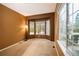 Cozy living room features a bay window, a lamp, and neutral carpeting at 10154 Fairgate Way, Highlands Ranch, CO 80126
