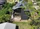 Modern home with solar panels, deck, and lush green surroundings at 360 S Ogden St, Denver, CO 80209